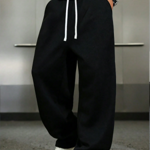 1 pièce Pantalon ample et décontracté pour hommes, de couleur unie avec jambes larges, avec cordon de serrage à la taille et grandes poches.